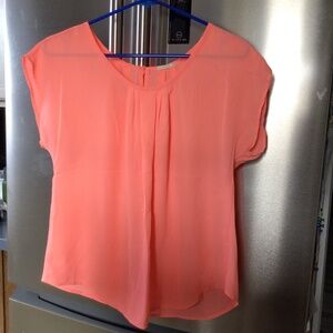 Bright peach blouse